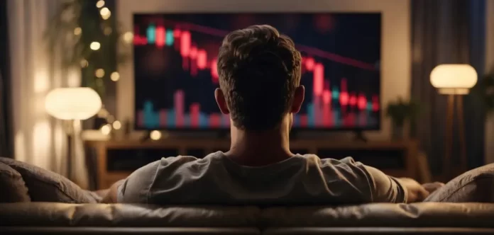 Mercado hoje — investidor acompanha gráfico de queda na televisão em tendência baixista